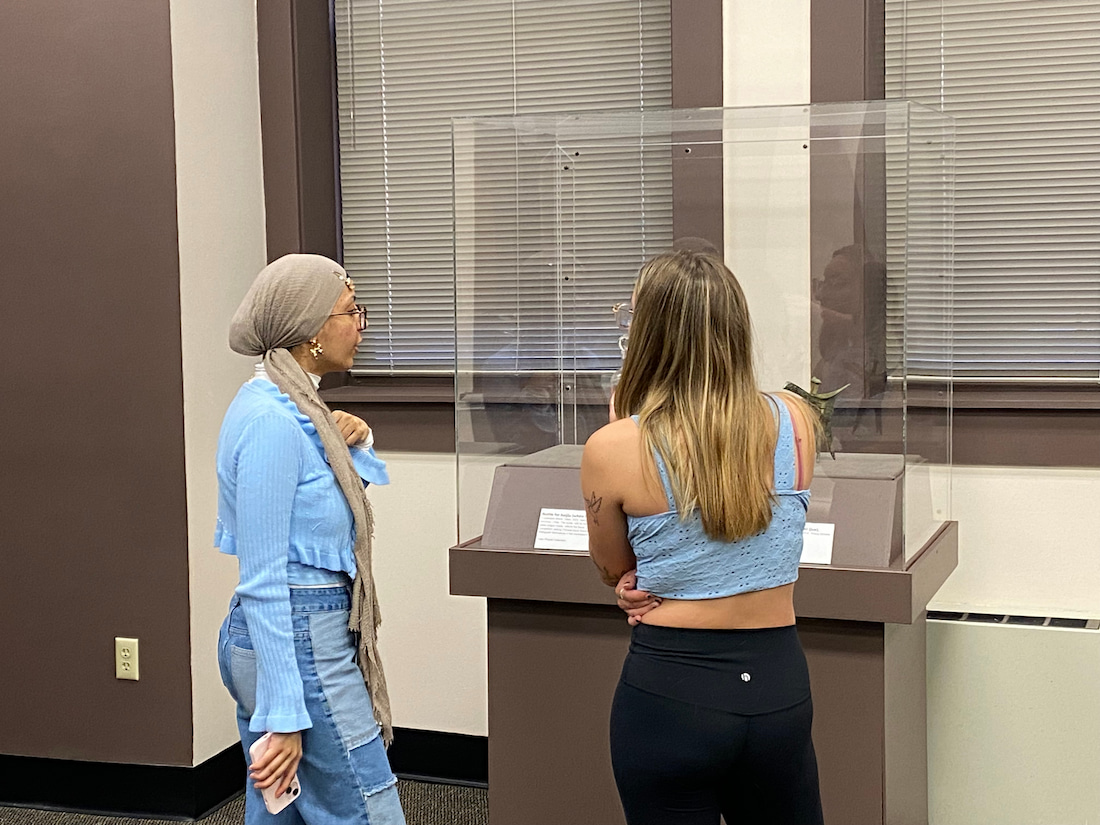 Two students examine a display in the Grosscup Museum of Anthropology