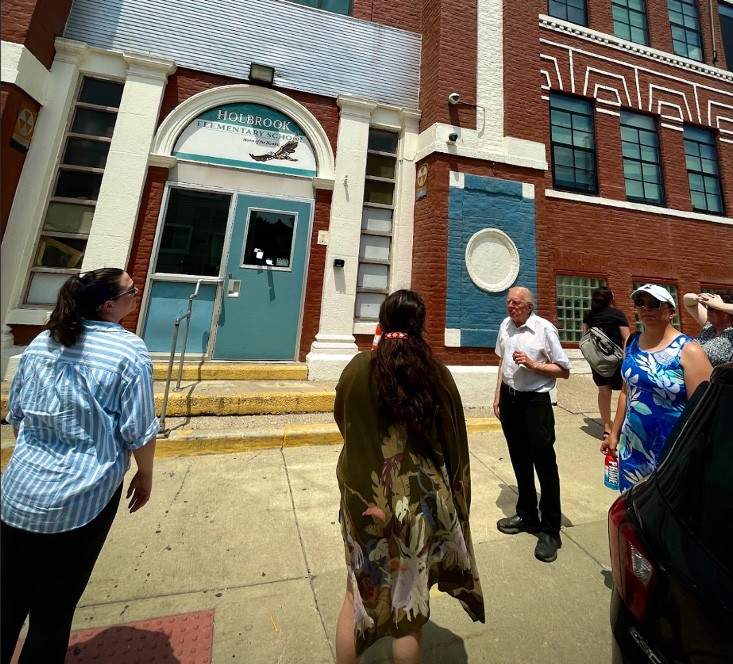 Femme Collective group taking a tour outside