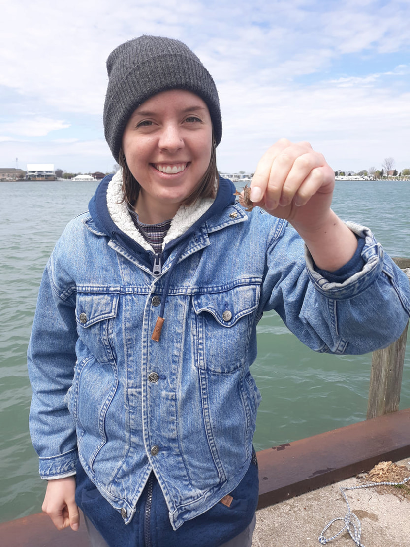 Katrina Lewandowski holding a mussel