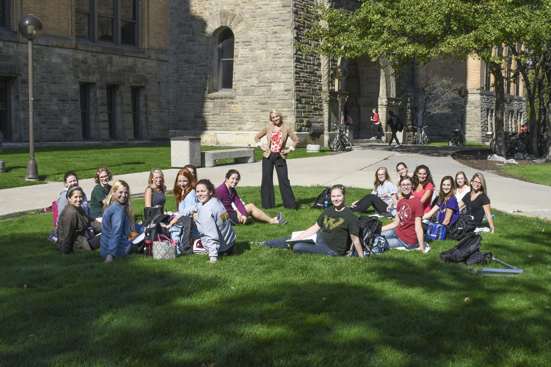 Shelly Jo Kraft with students outside