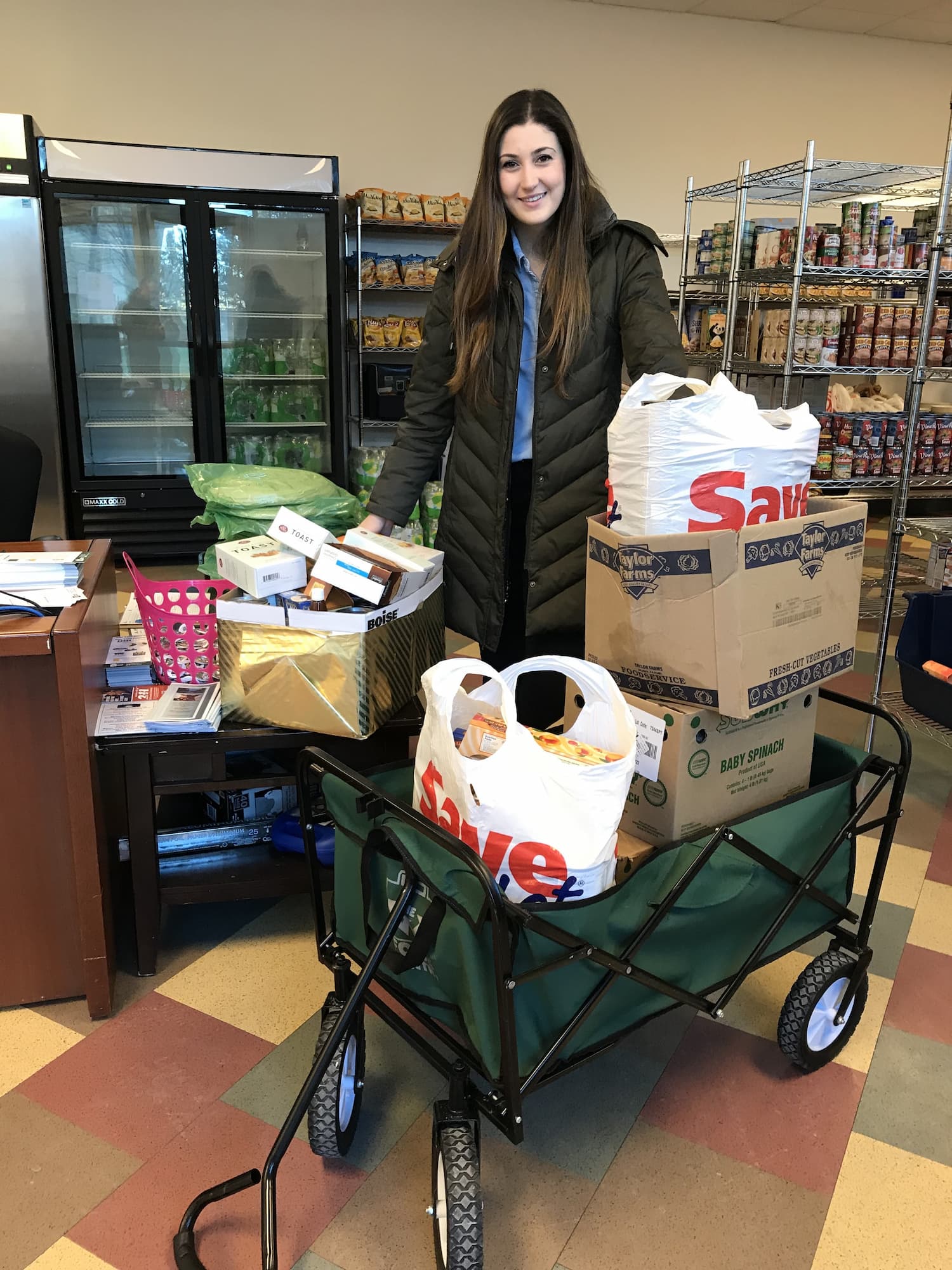 Camilla Cascardo with food cart at the WSU Food Pantry