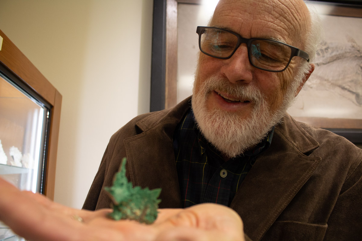 David Lowrie examines a specimen from the museum's collection
