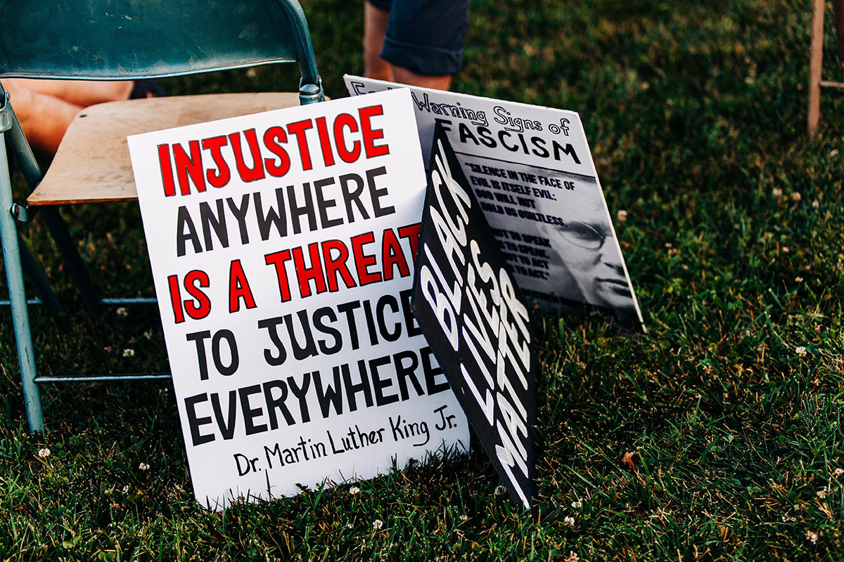 Injustice anywhere is a threat to justice everywhere sign on the lawn.